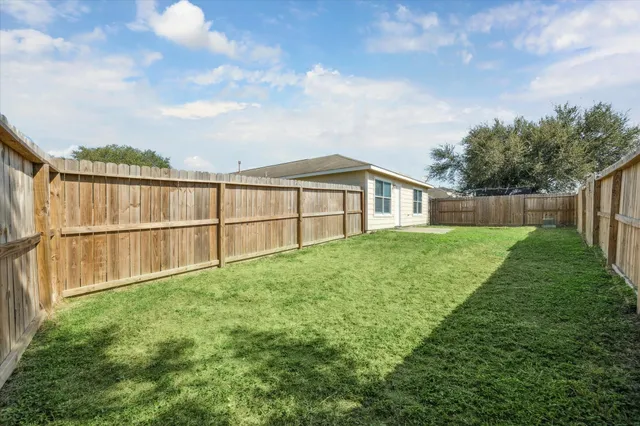 a view of backyard with green space