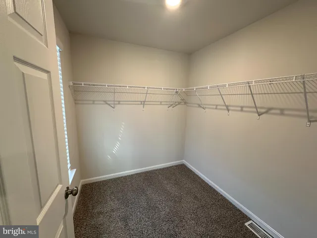 a view of a room with racks on the wall