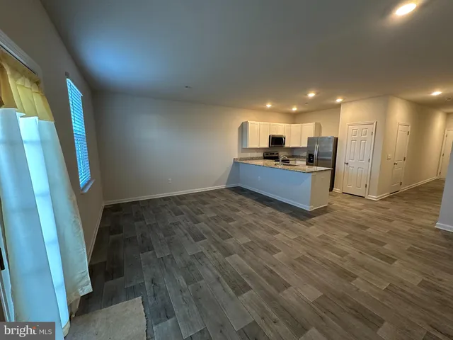 a view of a room with a furniture