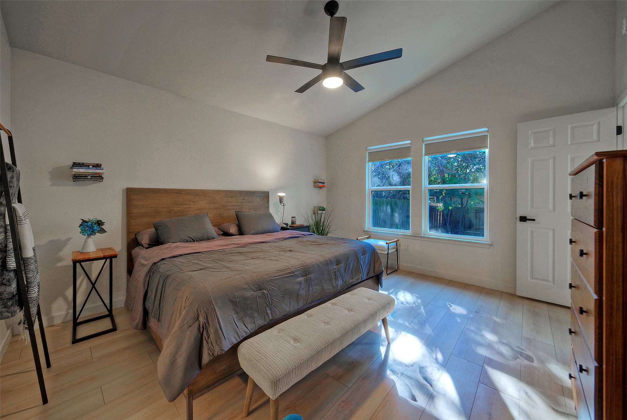 8406 Los Ranchos Drive Austin, TX 78749 - Photo 15 of 32 Vaulted ceilings and light wood floors create an airy, serene bedroom retreat.
