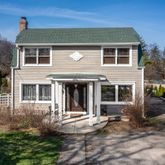 a view of a house with backyard and garden