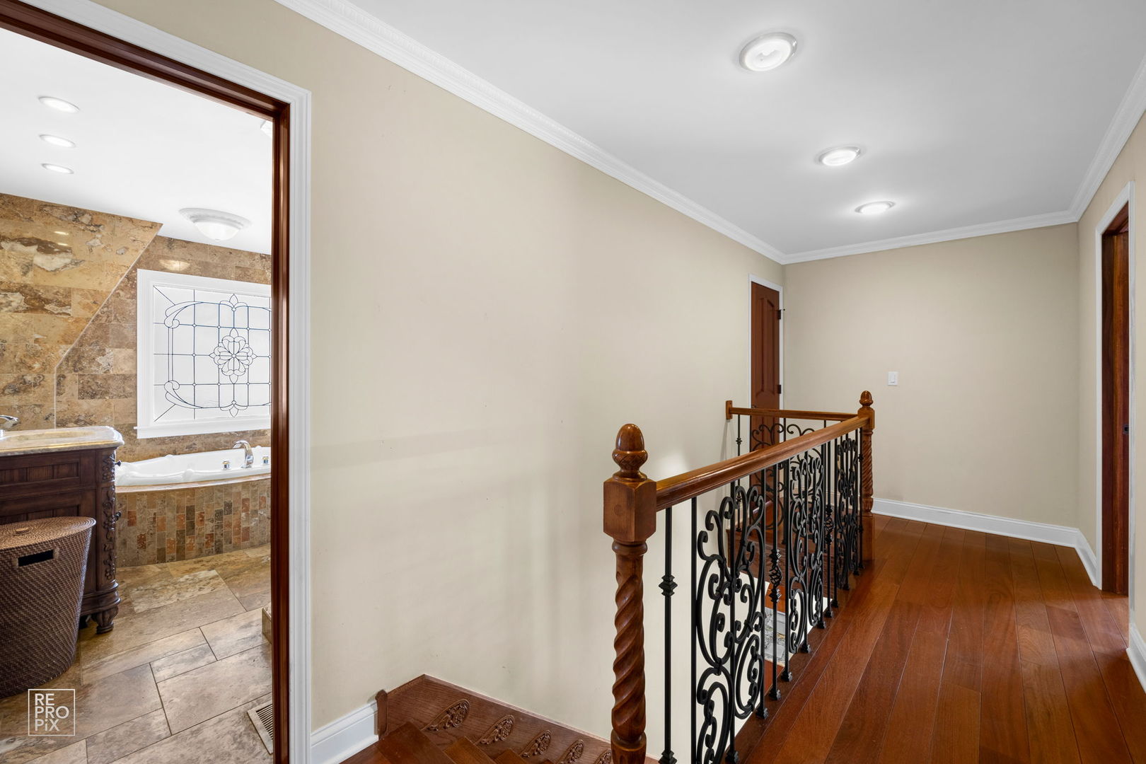 726 South Naperville Road Wheaton, IL 60187 - Photo 11 of 28 a view of a hallway with wooden floor and windows