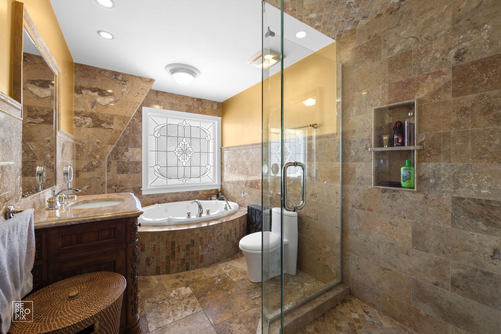 726 South Naperville Road Wheaton, IL 60187 - Photo 12 of 28 a bathroom with a double vanity sink toilet and shower