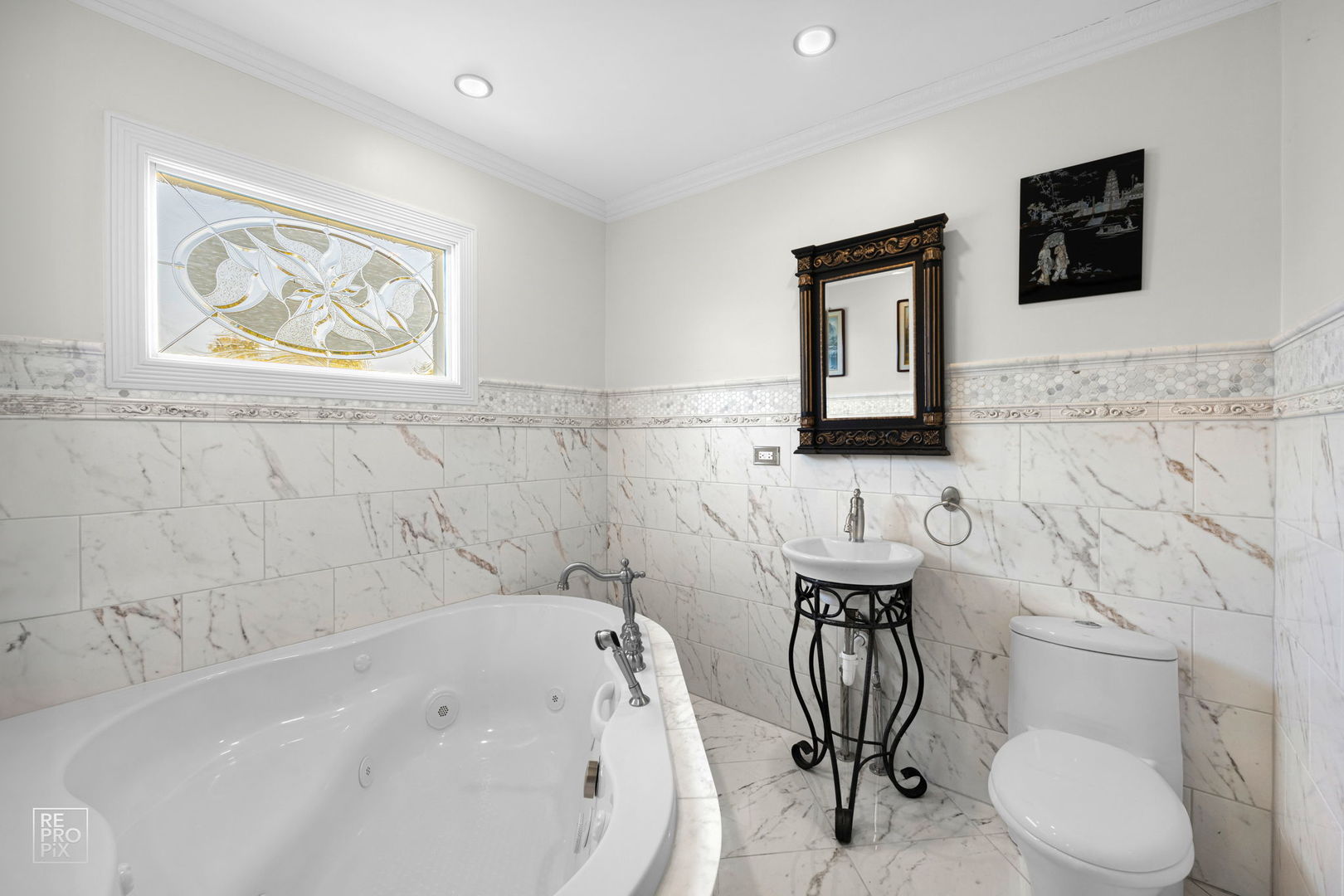 726 South Naperville Road Wheaton, IL 60187 - Photo 16 of 28 a bathroom with a sink a toilet and a mirror