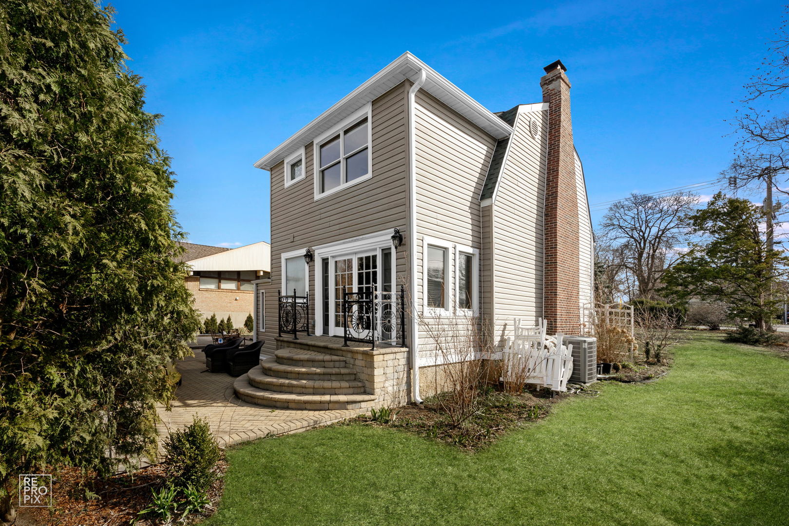 726 South Naperville Road Wheaton, IL 60187 - Photo 18 of 28 a front view of a house with garden
