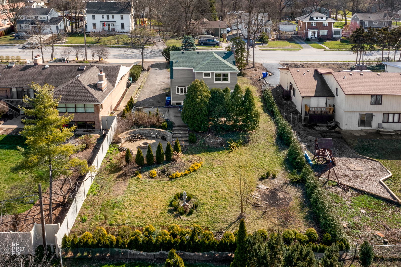 726 South Naperville Road Wheaton, IL 60187 - Photo 22 of 28 a view of a swimming pool with a yard and outdoor seating