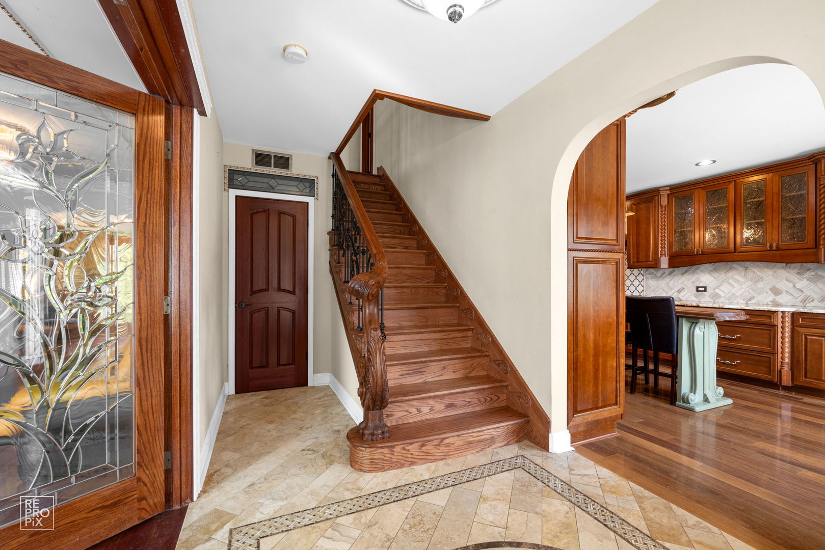 726 South Naperville Road Wheaton, IL 60187 - Photo 3 of 28 a view of an entryway with wooden floor and a livingroom view