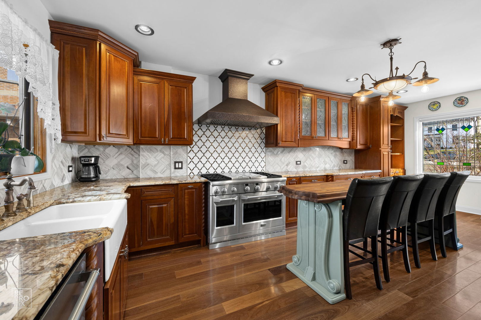 726 South Naperville Road Wheaton, IL 60187 - Photo 5 of 28 a kitchen with stainless steel appliances granite countertop a stove a sink dishwasher and a refrigerator with wooden floor