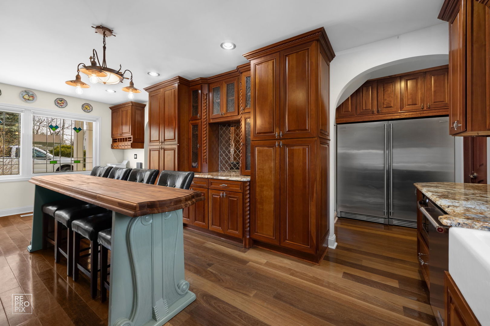 726 South Naperville Road Wheaton, IL 60187 - Photo 6 of 28 a kitchen with stainless steel appliances granite countertop a stove and a refrigerator