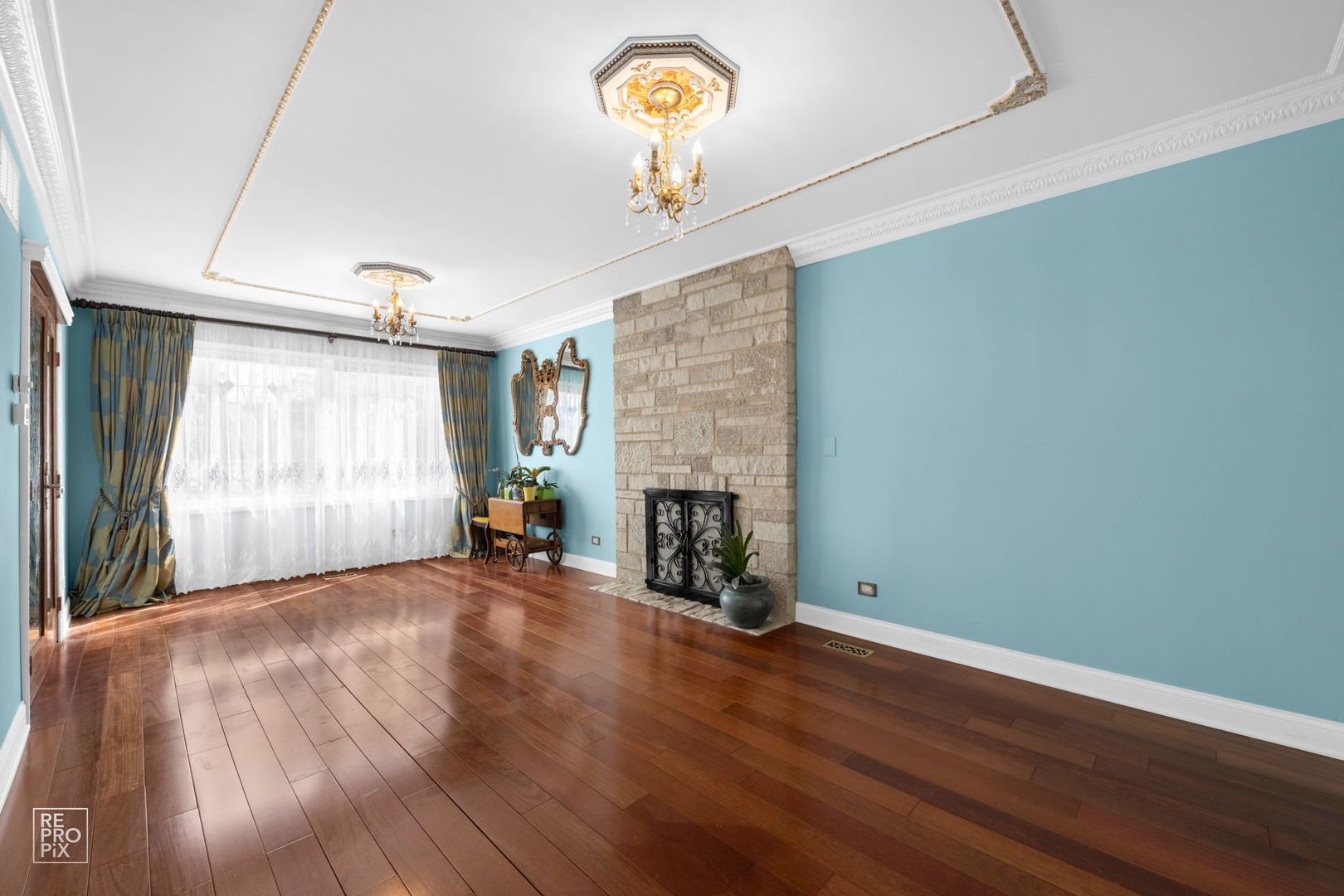 726 South Naperville Road Wheaton, IL 60187 - Photo 7 of 28 a view of a livingroom with a window and a fireplace