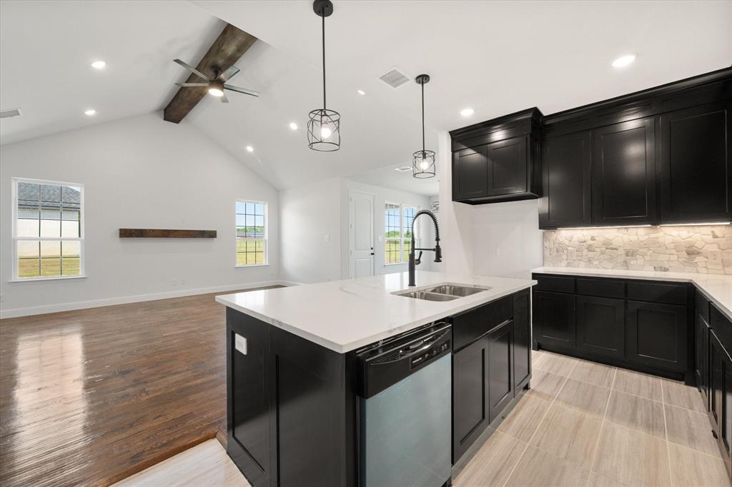 3400 Dobbins Road Corsicana, TX 75110 - Photo 13 of 40 a kitchen with a sink and microwave