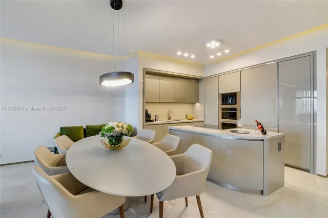 a bedroom with a bed and large windows