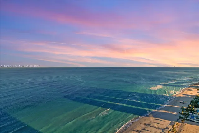 a bedroom with a bed and a lamp