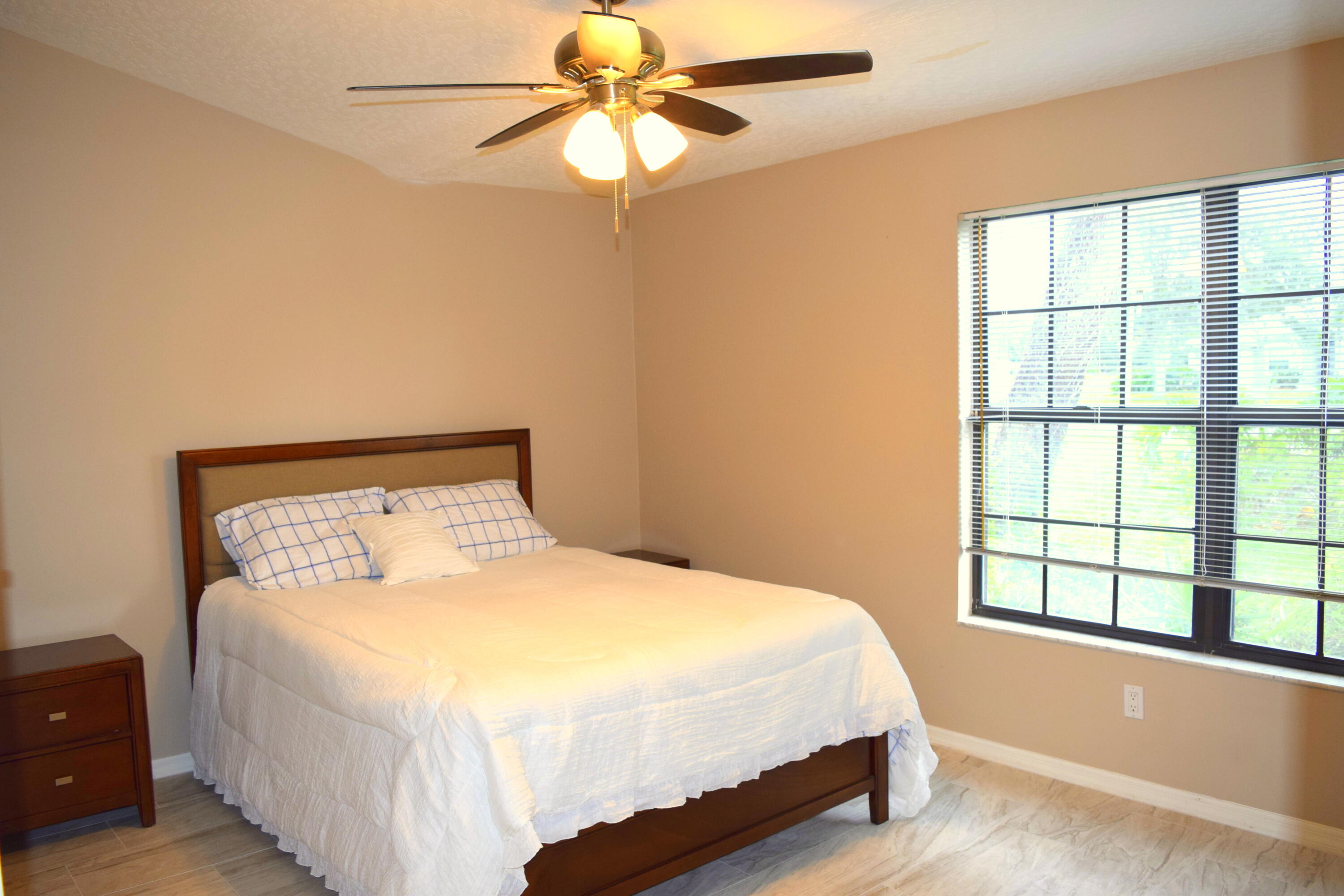 285 Utopia Circle Merritt Island, FL 32952 - Photo 14 of 32 a bedroom with a bed and a window