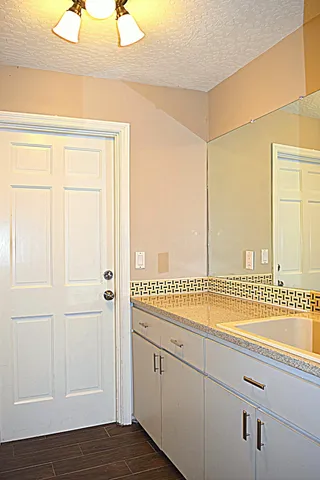 a view of a sink under an empty room