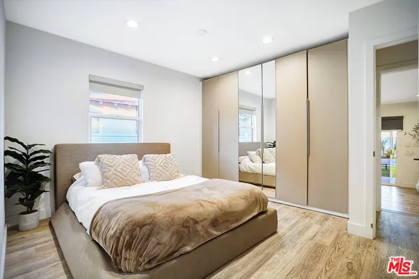 a bedroom with a bed and a couch