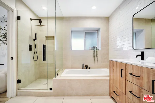 a living room with furniture a lamp and a table