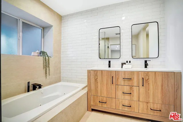 a table and chairs with the view of small yard