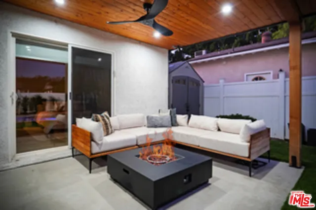 a view of a backyard with sitting area