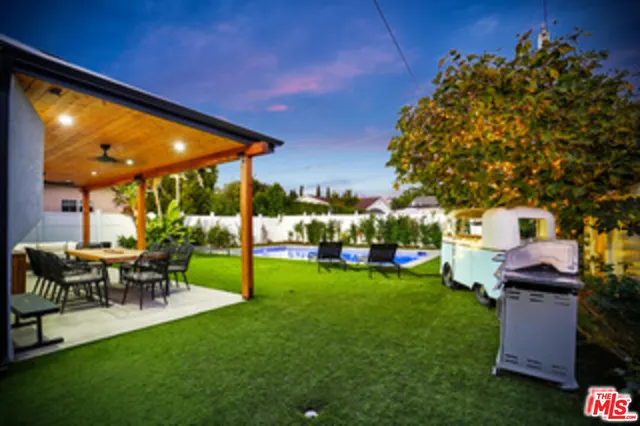 a view of swimming pool with outdoor seating