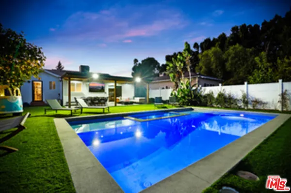 a view of a backyard with sitting area and slide