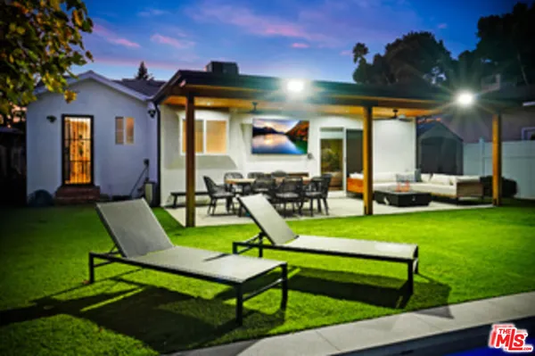 a living room with furniture and a area