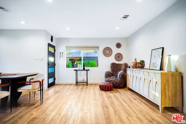 a view of kitchen with stainless steel appliances granite countertop refrigerator stove microwave and cabinets