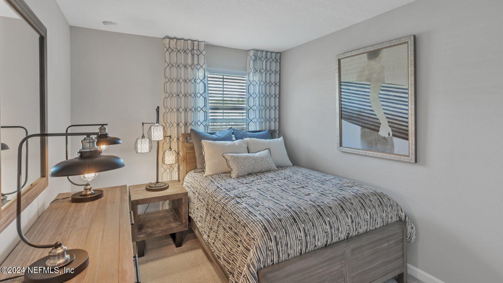 6919 Gable Grv Avenue Jacksonville, FL 32217 - Photo 9 of 14 a bedroom with a bed and window