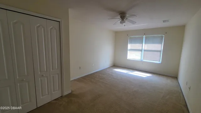 a view of empty room with windows