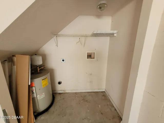 a view of hallway with furniture