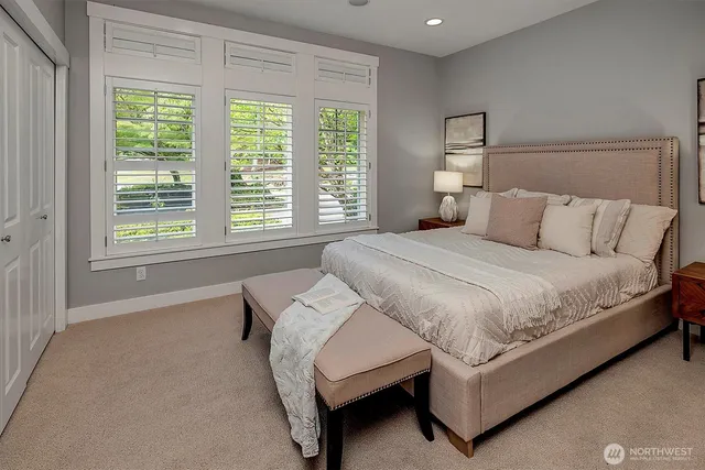 a bed room with a bed and a couch