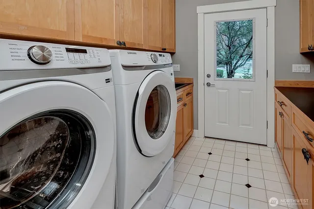 a utility room with dryer and washer