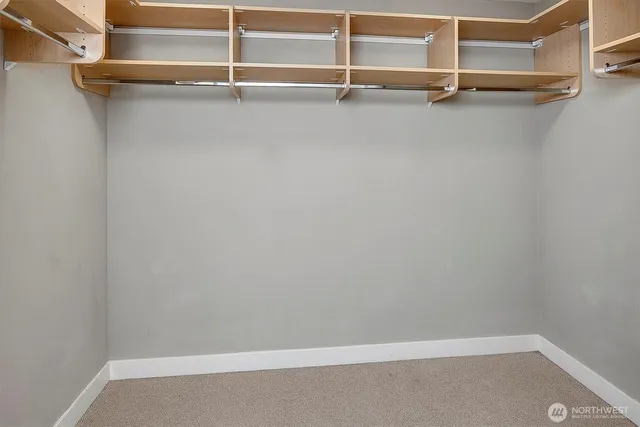 a view of an empty walk in closet
