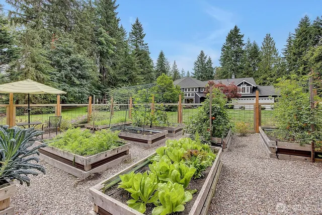a view of a backyard with sitting area