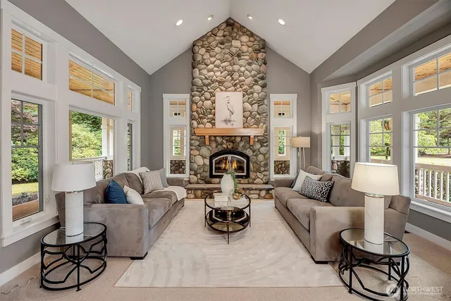 a living room with furniture fireplace and window