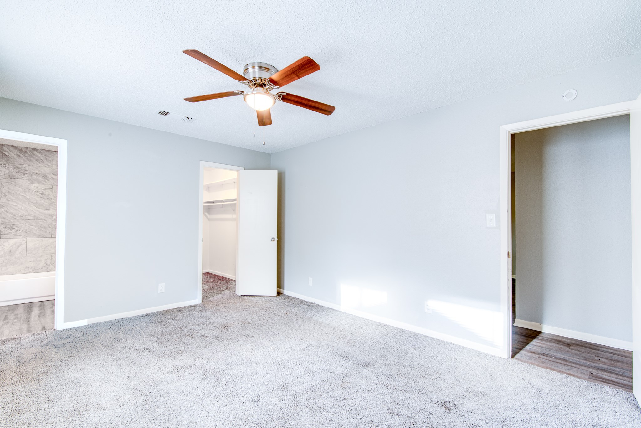 828 Noreda Street Angleton, TX 77515 - Photo 17 of 28 an empty room with closet and windows