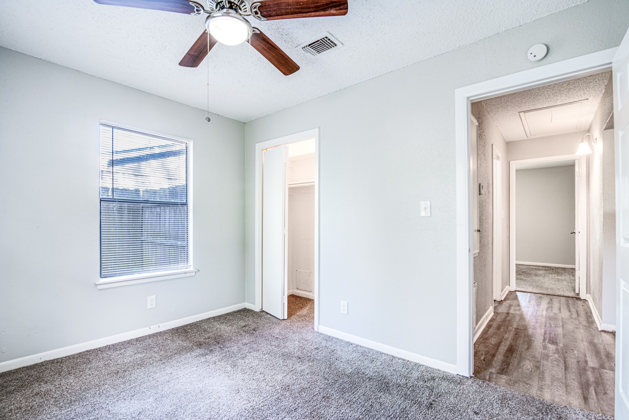 828 Noreda Street Angleton, TX 77515 - Photo 22 of 28 a view of a livingroom with a ceiling fan and window