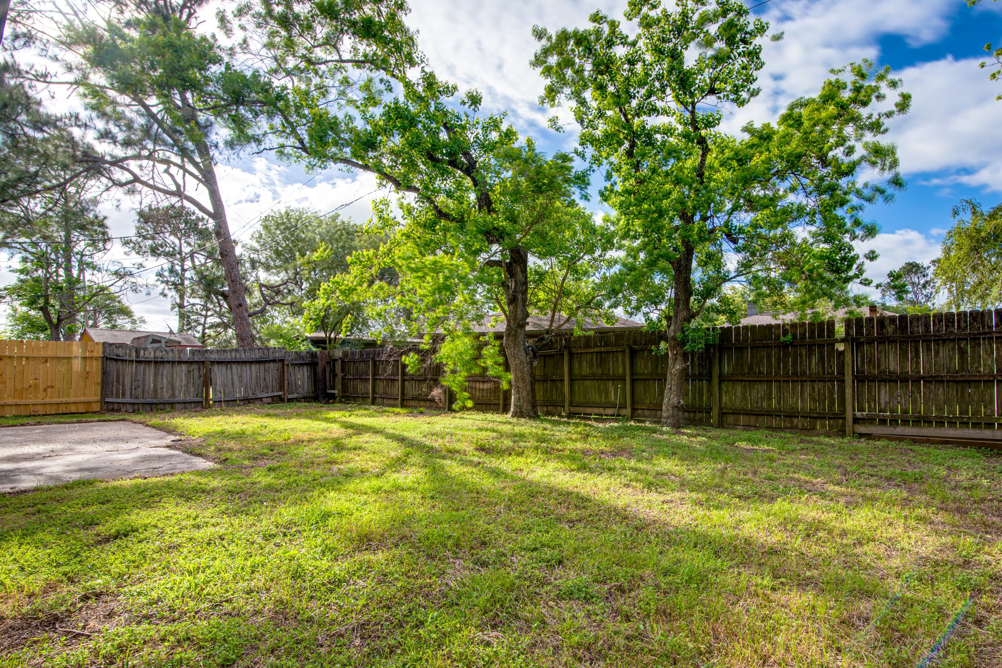 828 Noreda Street Angleton, TX 77515 - Photo 27 of 28 a swimming pool with trees in the background