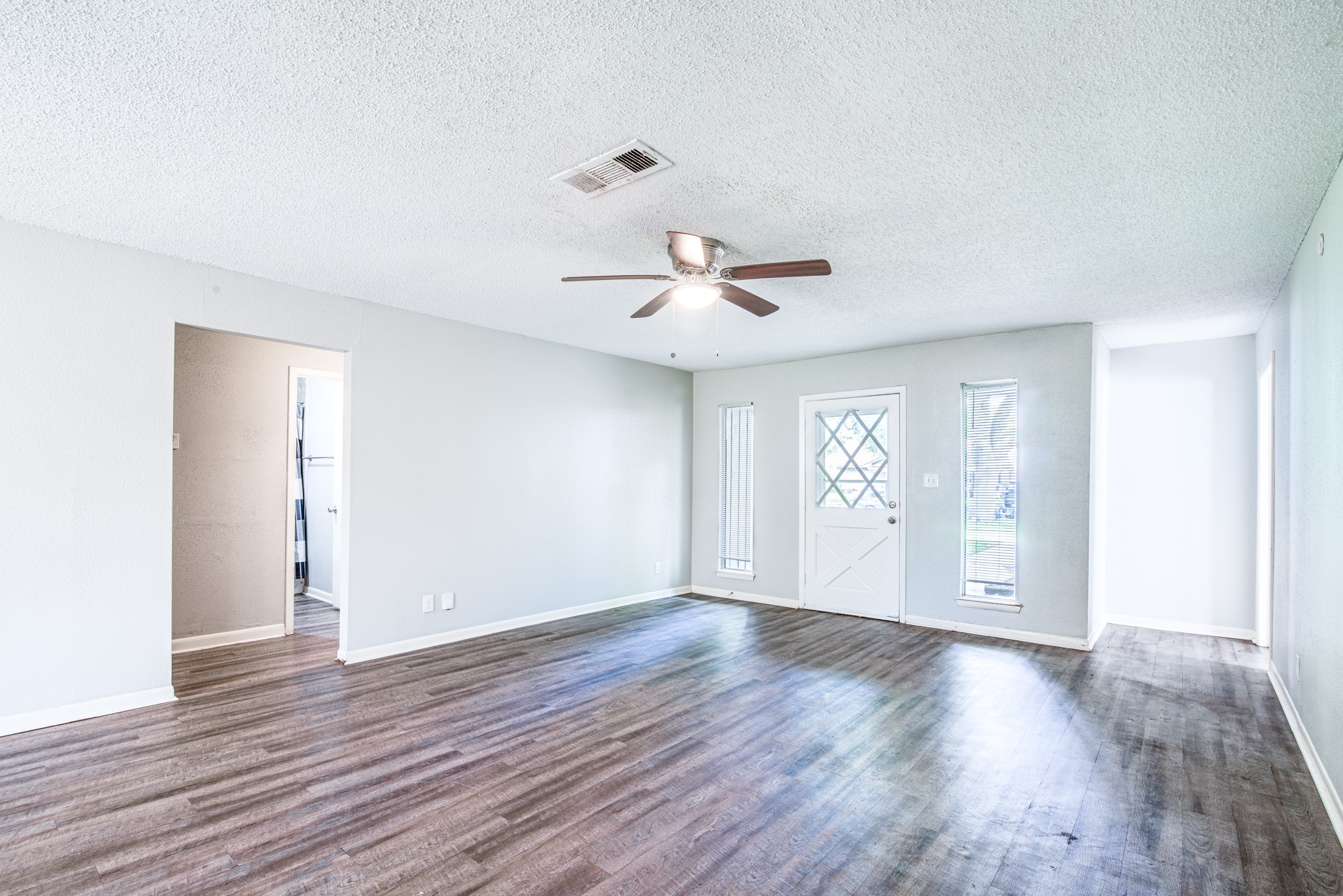 828 Noreda Street Angleton, TX 77515 - Photo 8 of 28 a view of an empty room with wooden floor