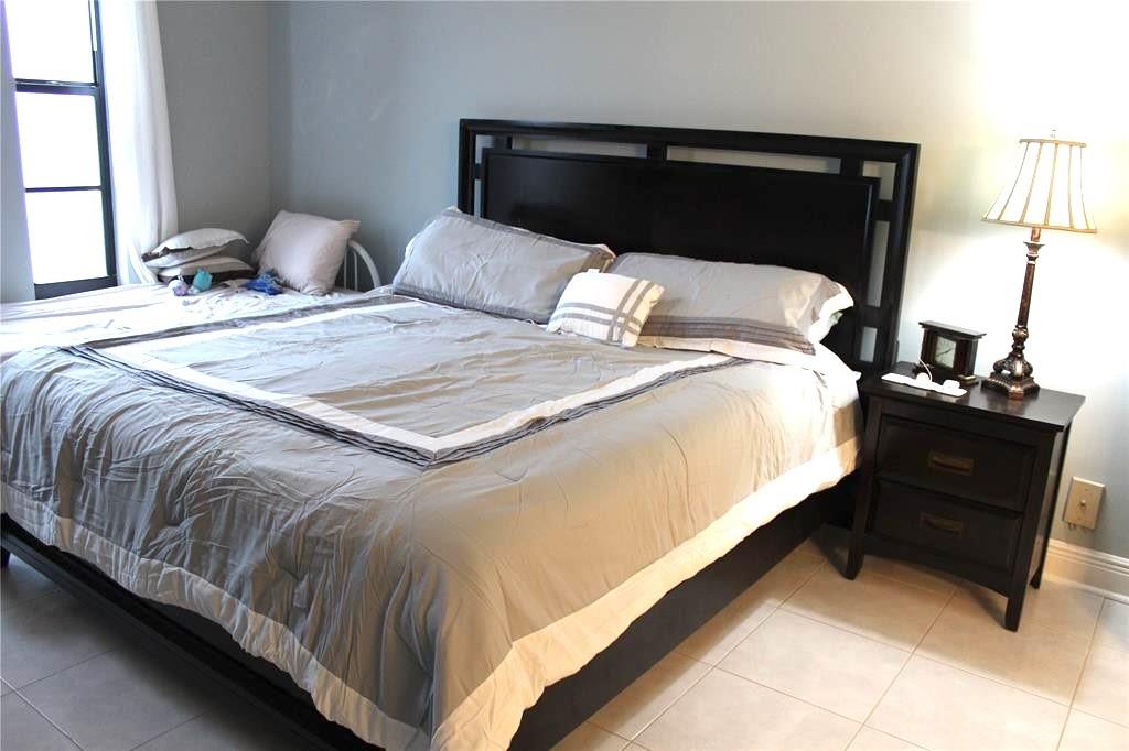 1000 South Ocean Boulevard, Unit 11K Pompano Beach, FL 33062 - Photo 14 of 25 a bedroom with a bed and window