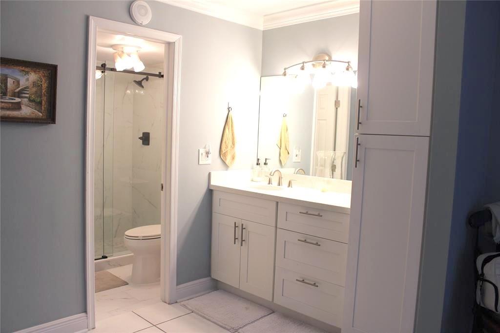 1000 South Ocean Boulevard, Unit 11K Pompano Beach, FL 33062 - Photo 15 of 25 a bathroom with a double vanity sink toilet and shower