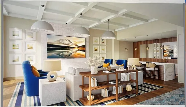 a living room with lots of furniture and a open kitchen view