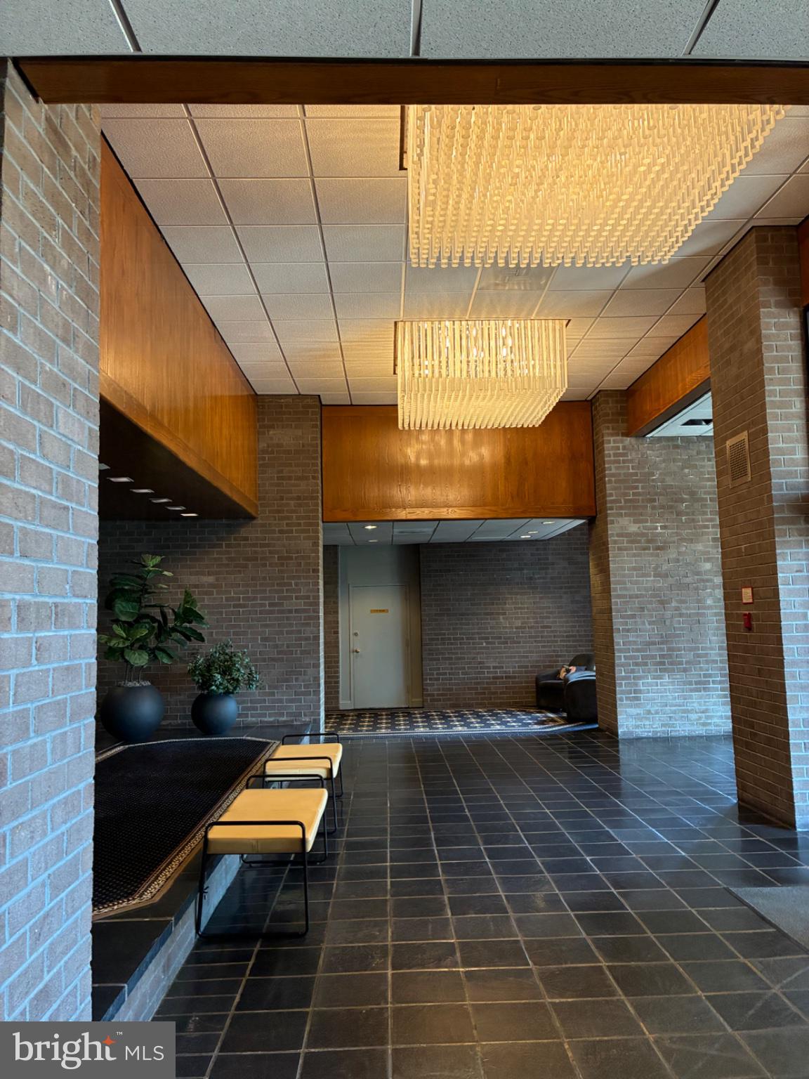 1800 Old Meadow Road, Unit 101 McLean, VA 22102 - Photo 8 of 77 Elegant lobby with modern lighting.