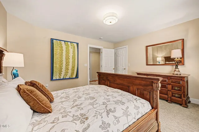 a spacious bathroom with a shower a sink and a mirror
