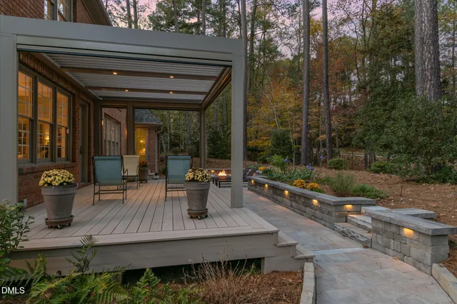 a view of a swimming pool with lounge chairs in patio