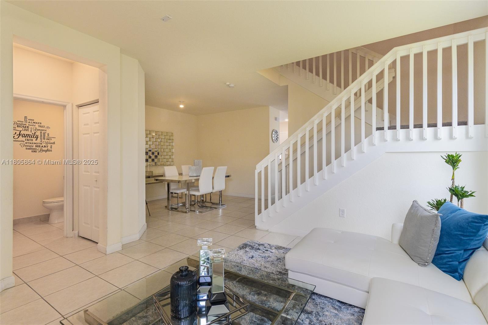10966 West 33rd Way Hialeah, FL 33018 - Photo 11 of 43 a living room with furniture and a dining table with kitchen view