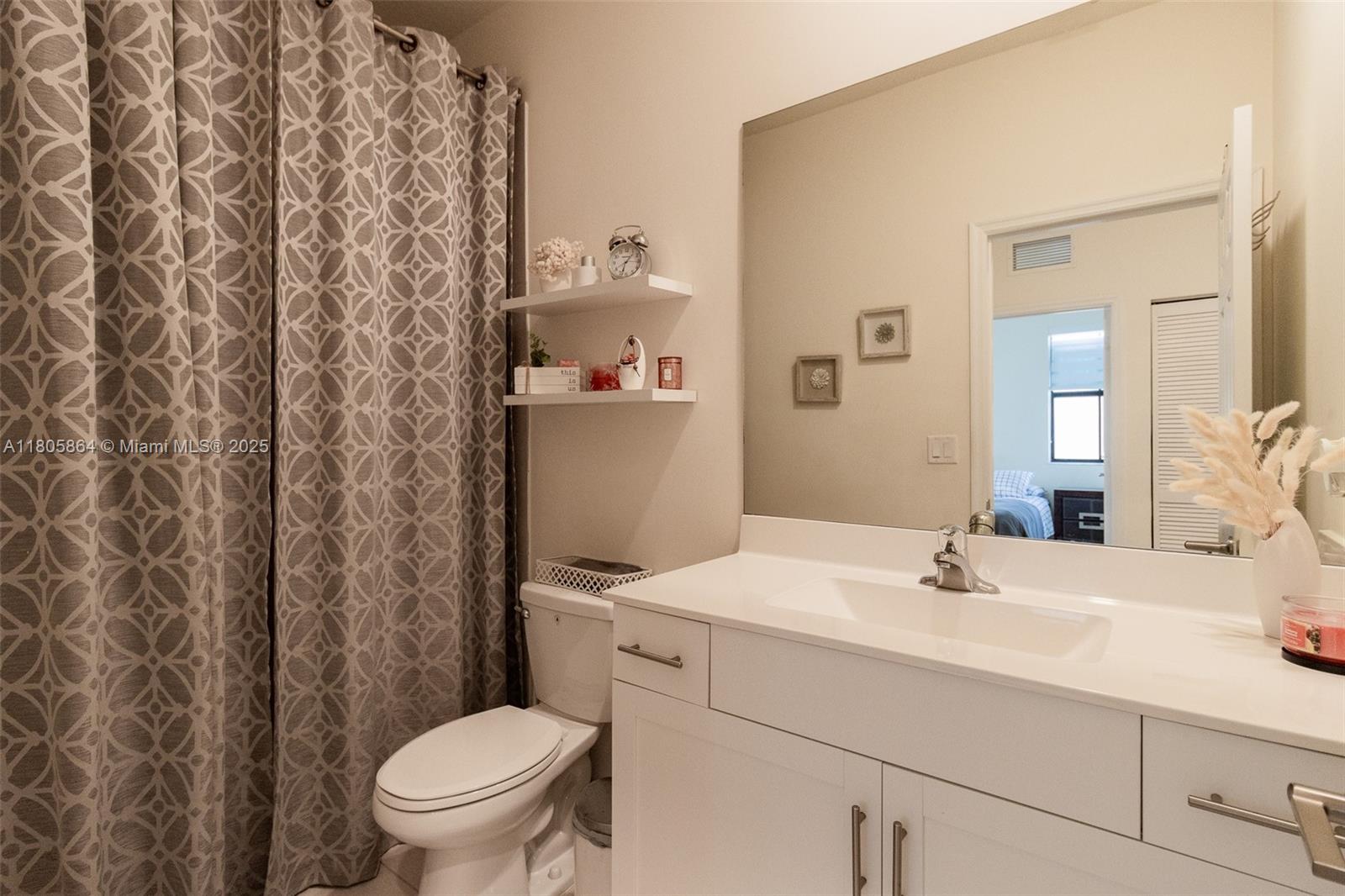 10966 West 33rd Way Hialeah, FL 33018 - Photo 28 of 43 a bathroom with a sink toilet and shower