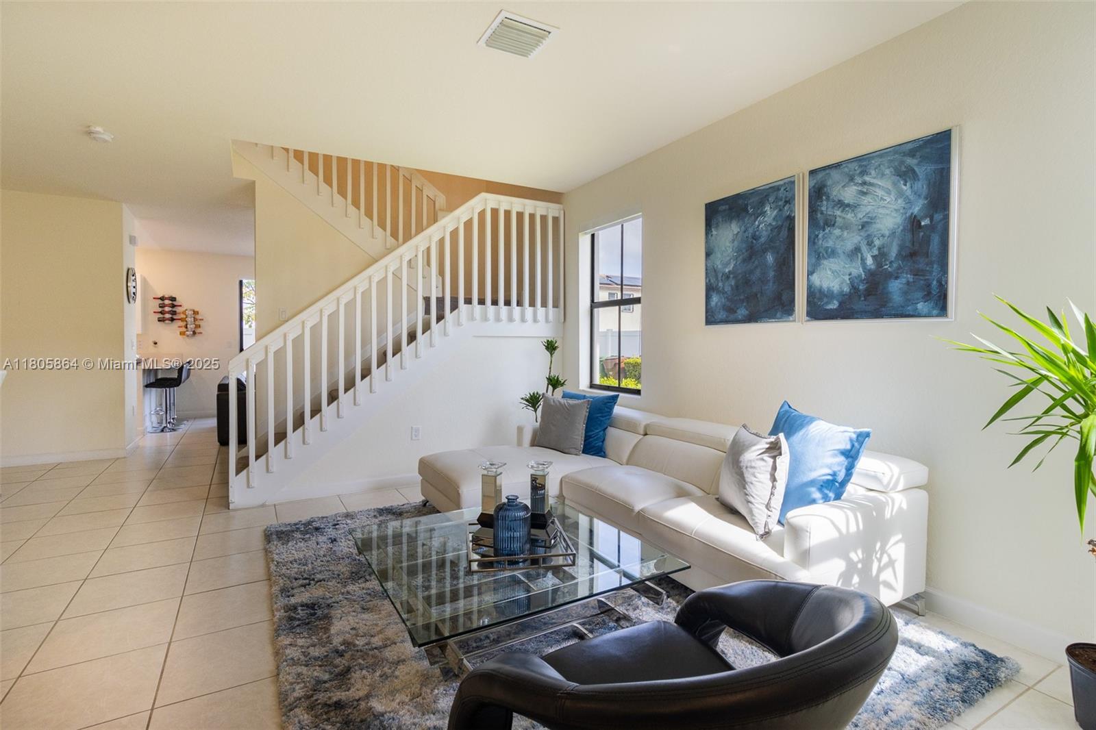 10966 West 33rd Way Hialeah, FL 33018 - Photo 7 of 43 a living room with furniture and a potted plant