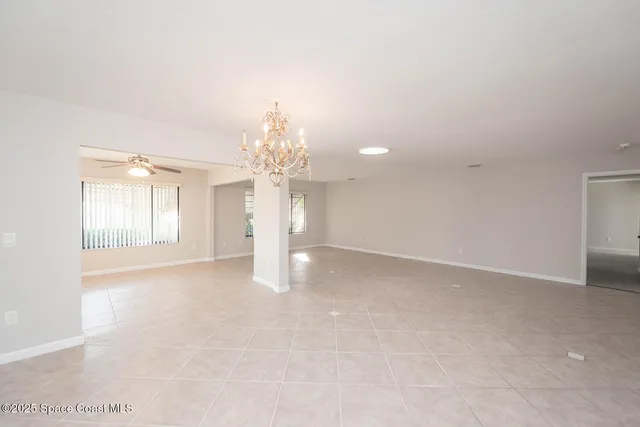a view of kitchen with furniture and a ceiling fan