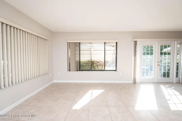 a kitchen with stainless steel appliances granite countertop a refrigerator and a stove